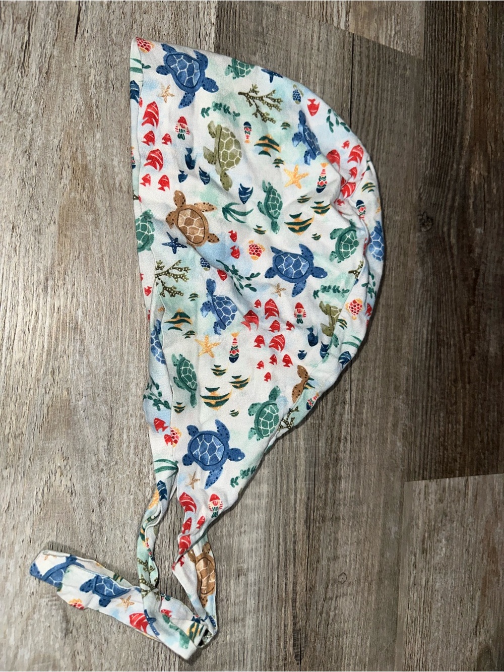 Ocean tie-back surgical cap